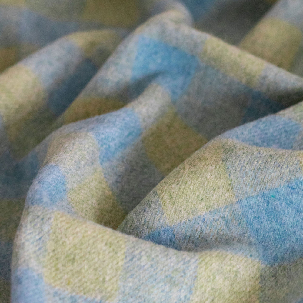 Close-up of checkered fabric with blue and green pattern