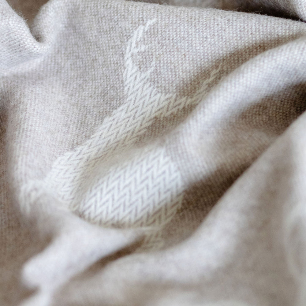 Close-up of beige fabric with subtle texture