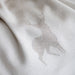 Close-up of beige fabric with a subtle pattern
